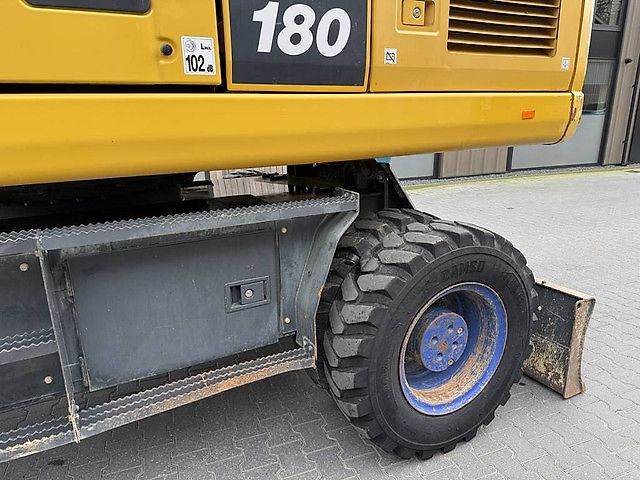 Pelle Komatsu PW180-10 + OilQuick OQ70-55